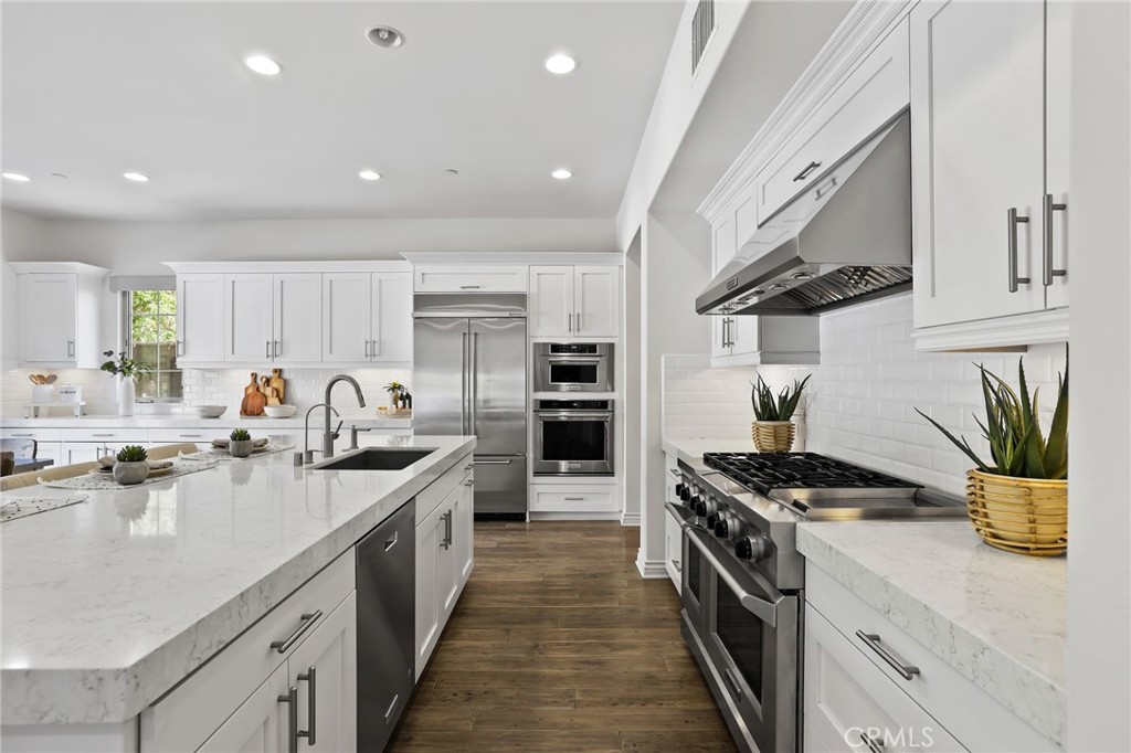 49 Saddlehorn Irvine, CA 92602 - Photo 15 of 73 a kitchen with stainless steel appliances a sink stove and cabinets