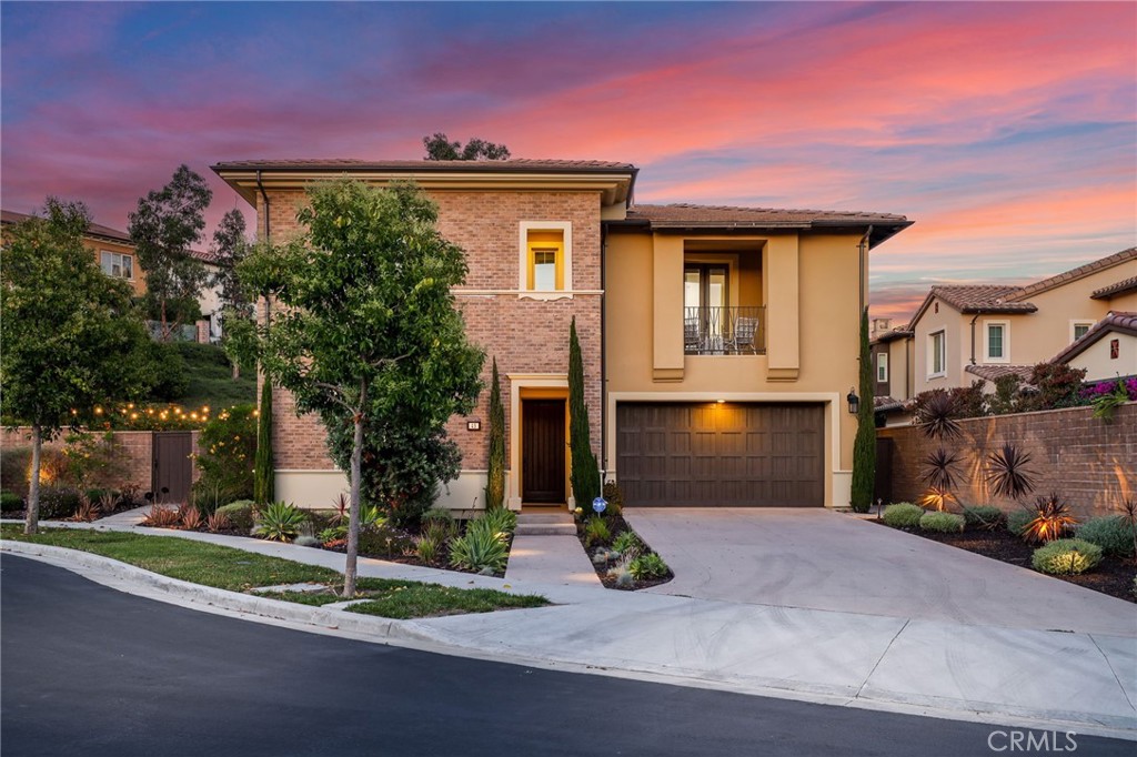 49 Saddlehorn Irvine, CA 92602 - Photo 2 of 73 a front view of a house with a yard and garage