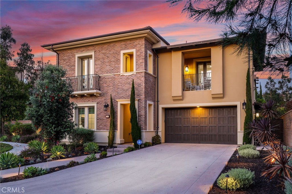 49 Saddlehorn Irvine, CA 92602 - Photo 3 of 73 a front view of a house with a yard and garage