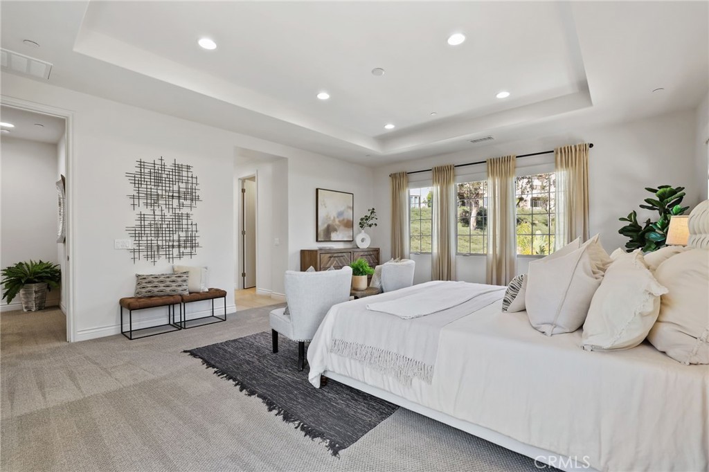 49 Saddlehorn Irvine, CA 92602 - Photo 33 of 73 a bedroom with a large bed and windows