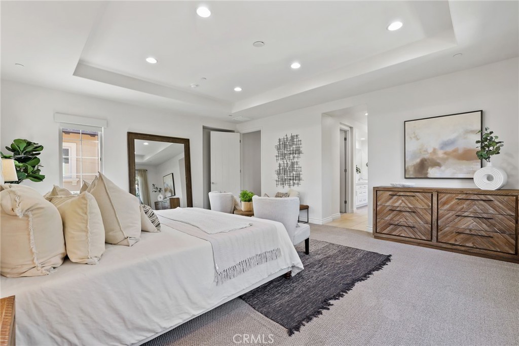 49 Saddlehorn Irvine, CA 92602 - Photo 35 of 73 a bedroom with a large bed and wooden floor