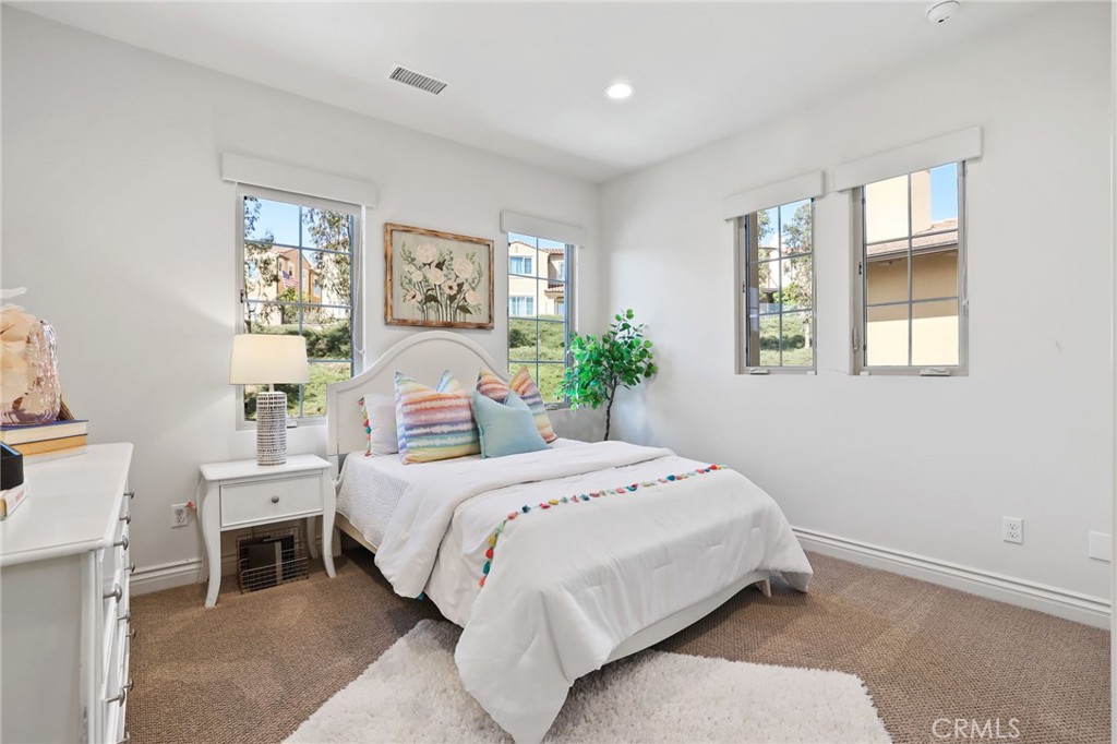 49 Saddlehorn Irvine, CA 92602 - Photo 39 of 73 a bedroom with a large bed and a window