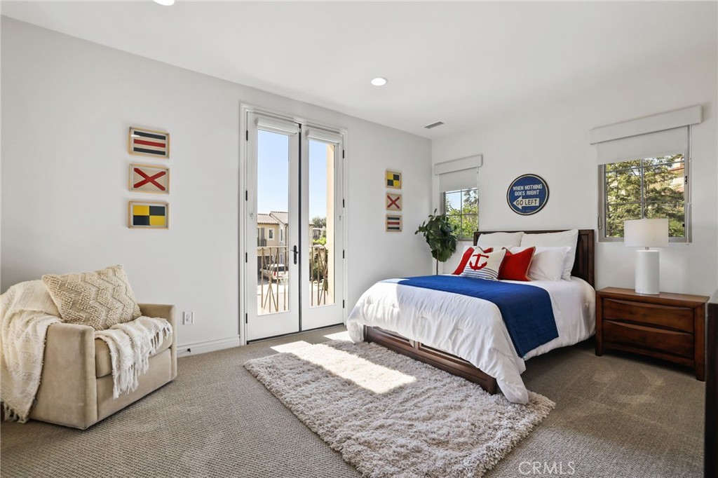 49 Saddlehorn Irvine, CA 92602 - Photo 40 of 73 a bedroom with a bed and a couch