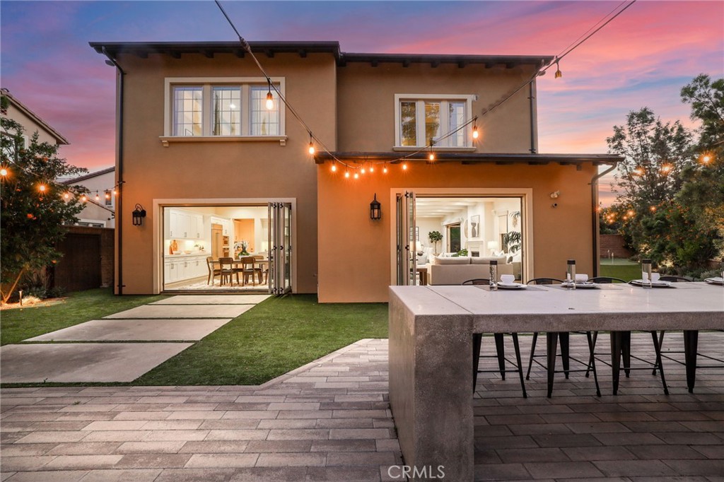 49 Saddlehorn Irvine, CA 92602 - Photo 59 of 73 a view of a house with a dining table and chairs with wooden floor