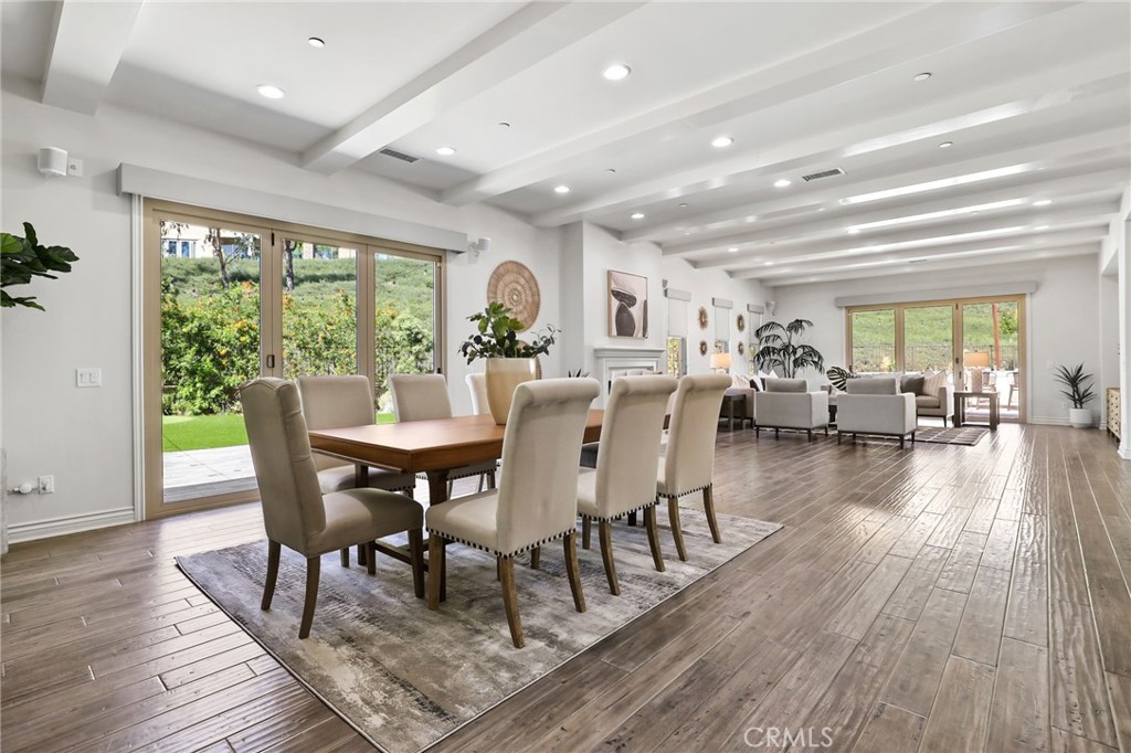 49 Saddlehorn Irvine, CA 92602 - Photo 6 of 73 a view of a dining room with furniture window and wooden floor