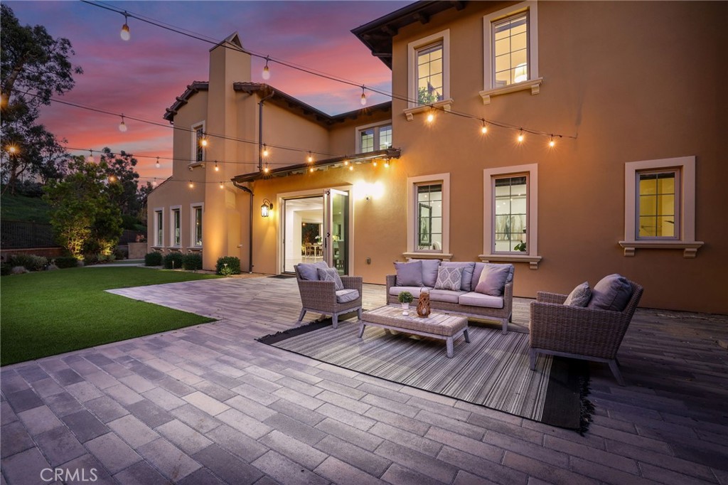 49 Saddlehorn Irvine, CA 92602 - Photo 67 of 73 a view of a patio with couches chairs and a yard