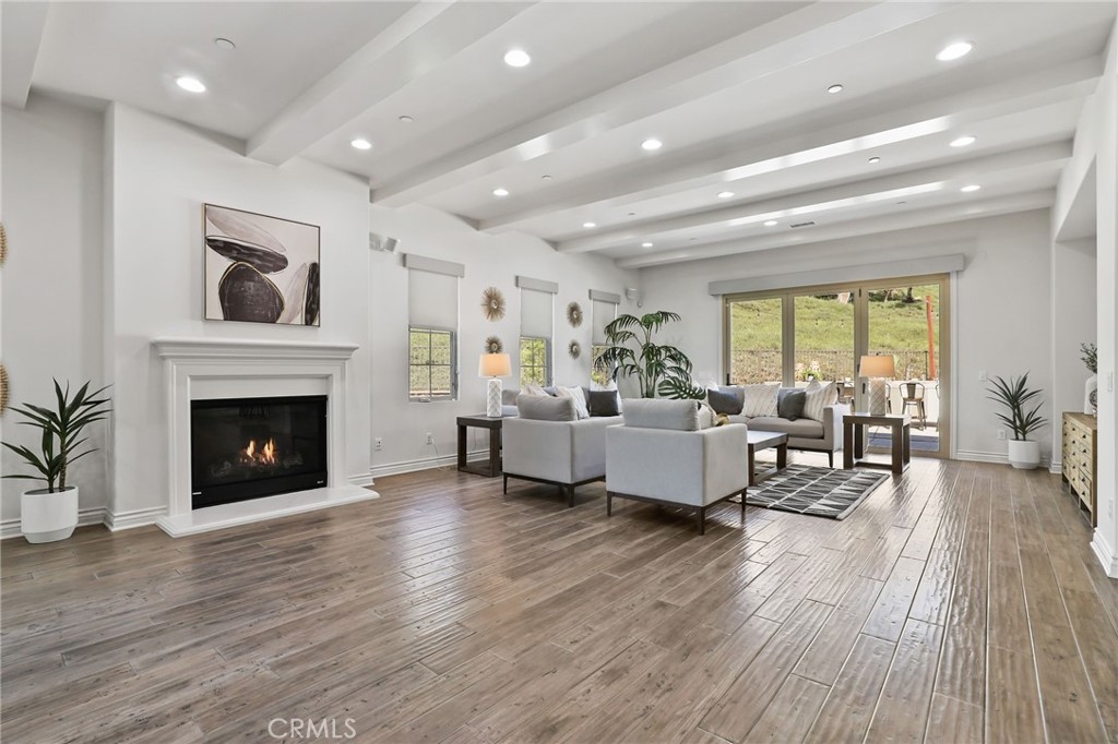 49 Saddlehorn Irvine, CA 92602 - Photo 9 of 73 a living room with furniture and a fireplace