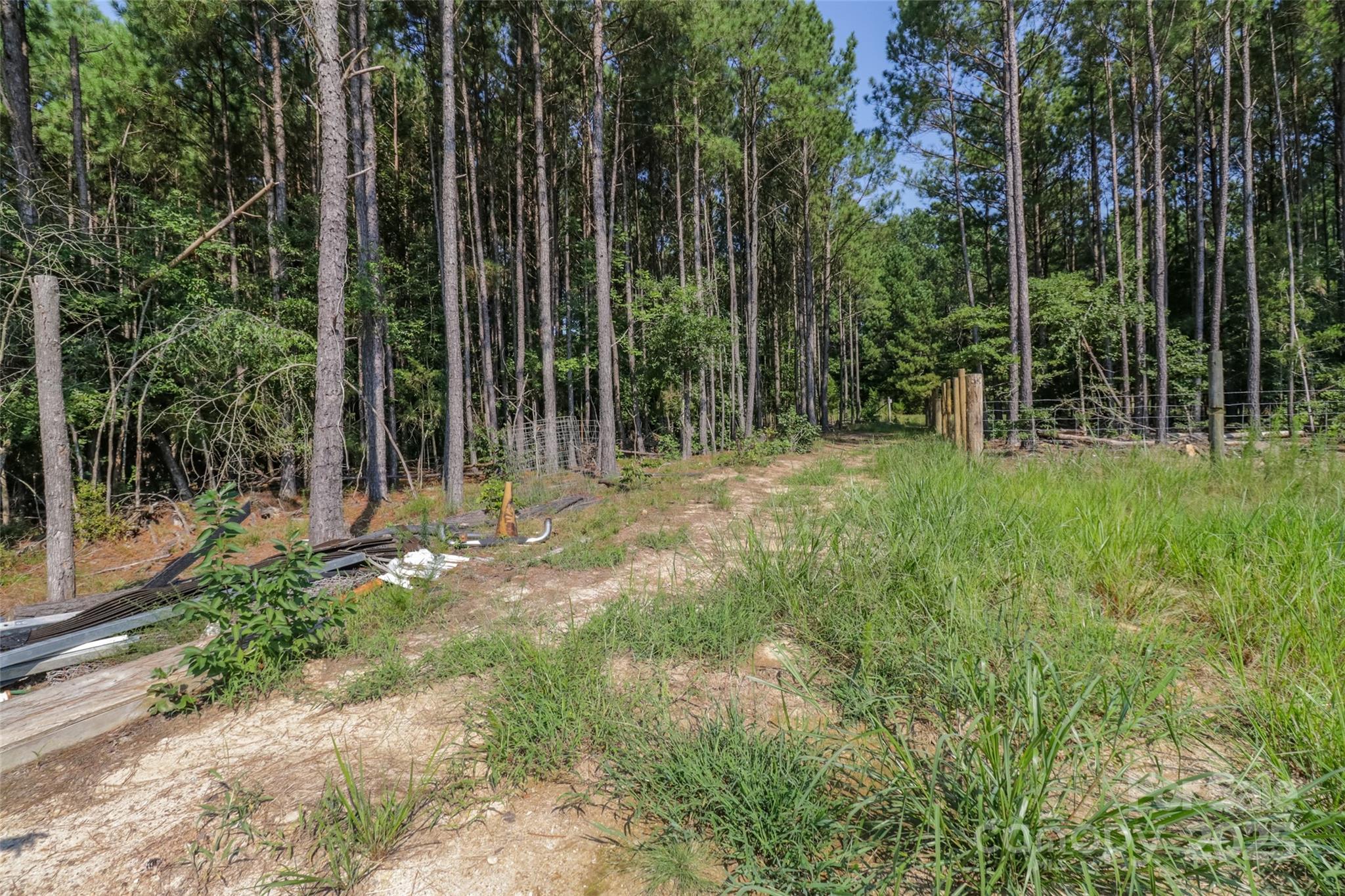 0 Shaw Avenue Waxhaw, NC 28173 - Photo 11 of 18 a view of outdoor space with deck and trees