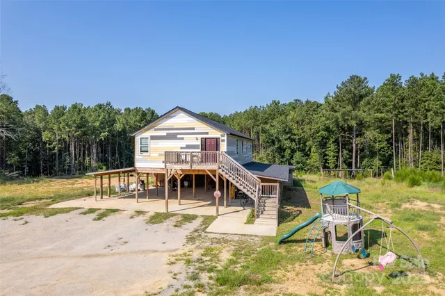 a view of a swimming pool with a lounge chair
