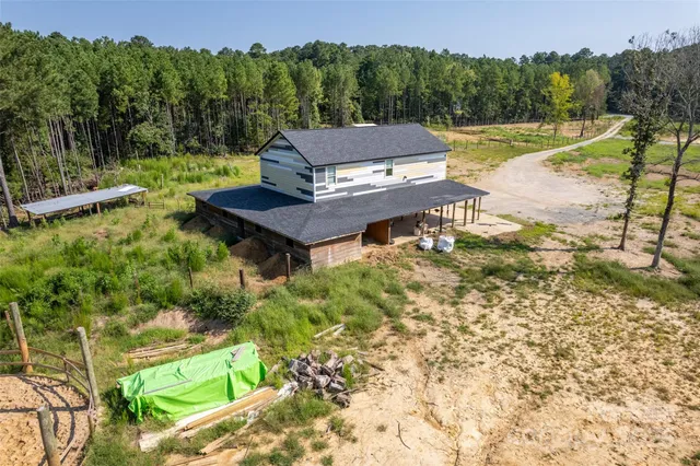 a view of a wooden deck and a yard
