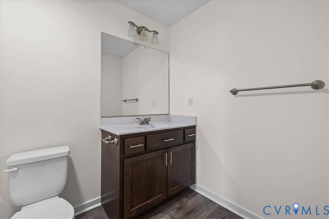 11325 Webb Road Disputanta, VA 23842 - Photo 20 of 32 a bathroom with a toilet sink and mirror