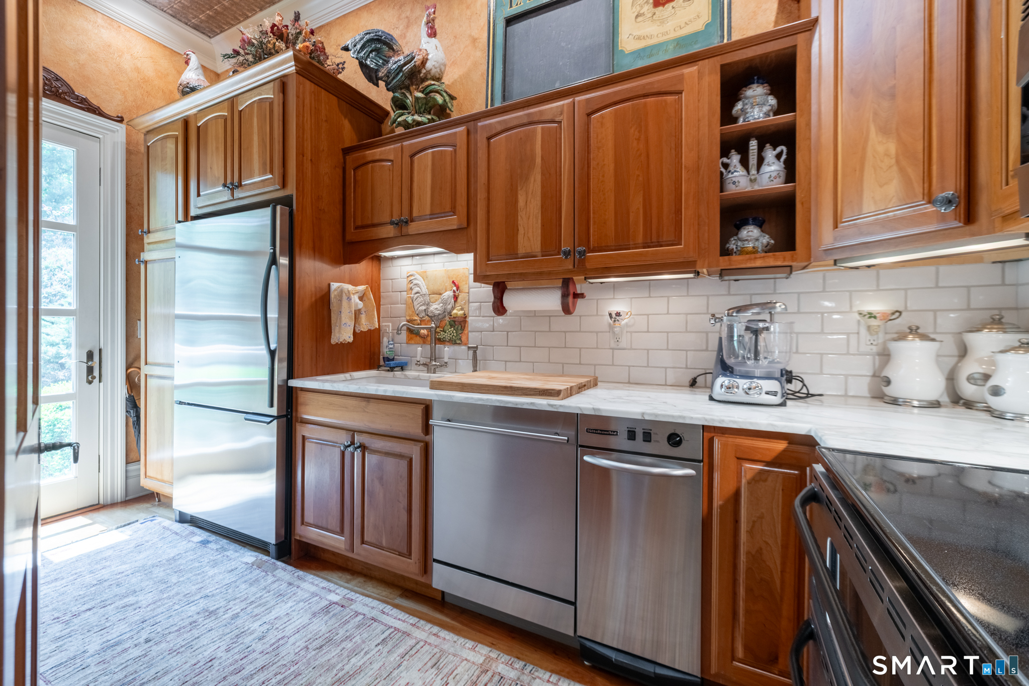 7 Equestrian Ridge Newtown, CT 06470 - Photo 19 of 40 a kitchen with stainless steel appliances granite countertop a sink and cabinets