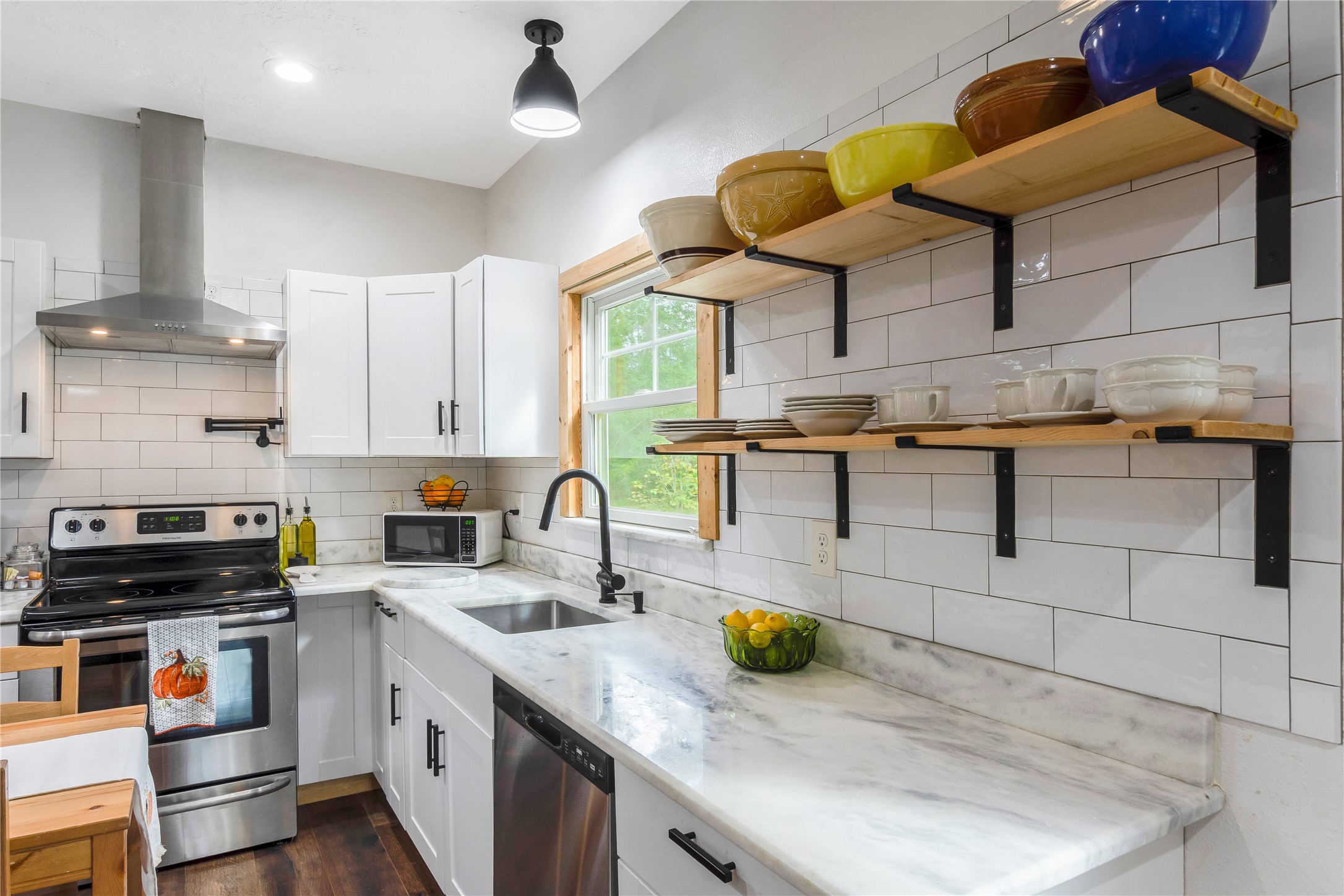 1080 Hill Road Willis, TX 77378 - Photo 12 of 33 a kitchen with stainless steel appliances granite countertop a sink a stove and a wooden cabinets