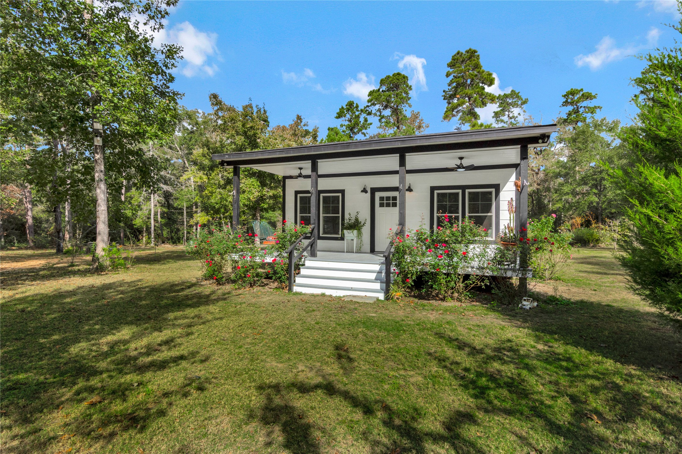 1080 Hill Road Willis, TX 77378 - Photo 2 of 33 a view of a house with backyard and sitting area