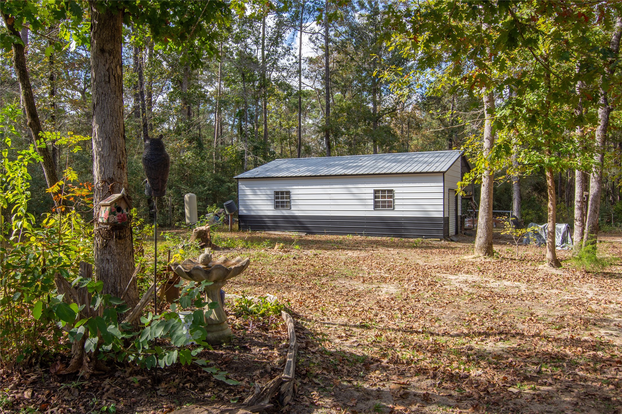 1080 Hill Road Willis, TX 77378 - Photo 25 of 33 a house view with a backyard space