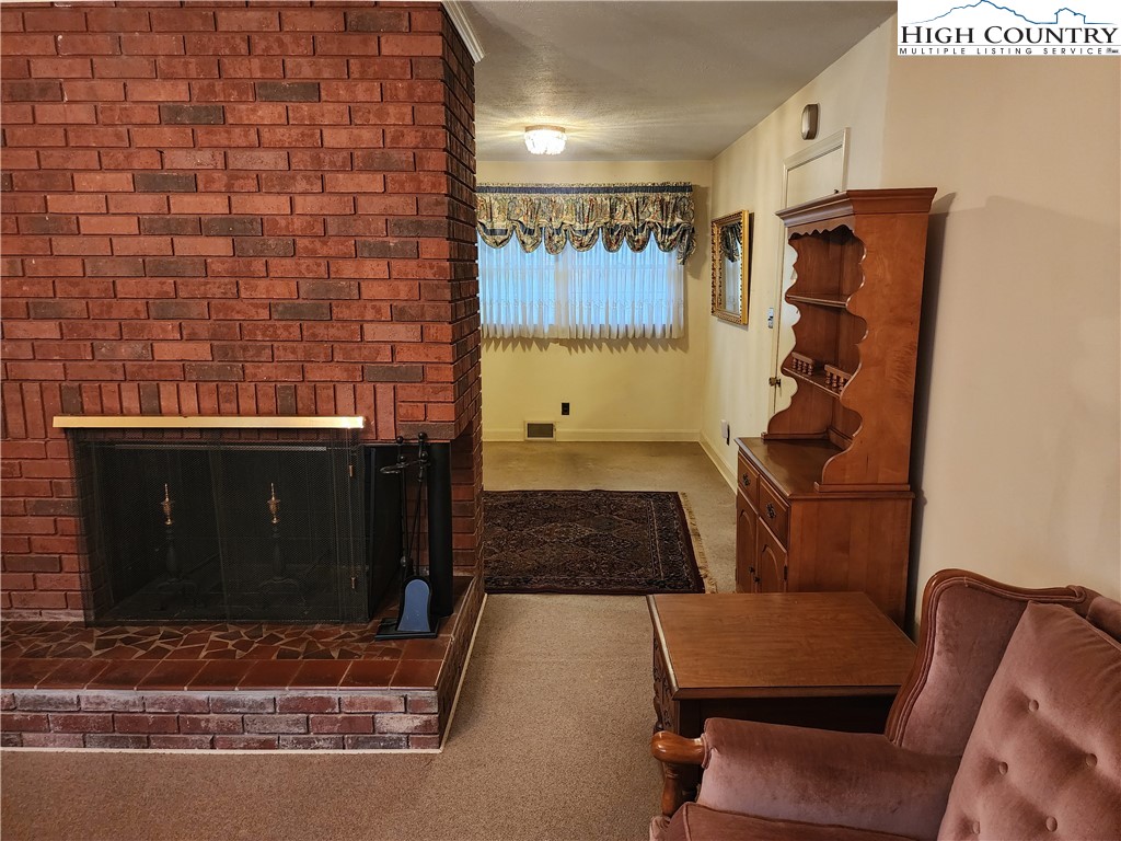 865 Armory Road North Wilkesboro, NC 28659 - Photo 13 of 40 a room with furniture and a rug