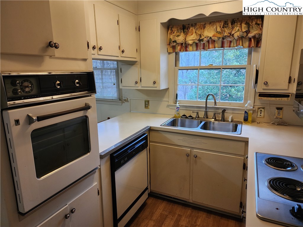 865 Armory Road North Wilkesboro, NC 28659 - Photo 18 of 40 a kitchen with cabinets appliances and a sink