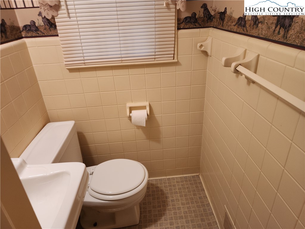 865 Armory Road North Wilkesboro, NC 28659 - Photo 27 of 40 a white toilet sitting next to a white sink