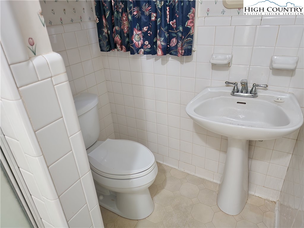 865 Armory Road North Wilkesboro, NC 28659 - Photo 30 of 40 a white toilet sitting next to a white sink