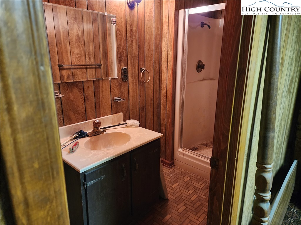 865 Armory Road North Wilkesboro, NC 28659 - Photo 39 of 40 a bathroom with a sink and a mirror