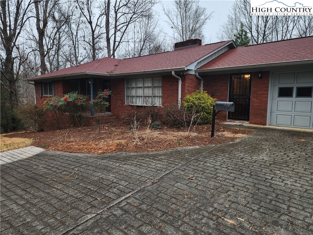 865 Armory Road North Wilkesboro, NC 28659 - Photo 4 of 40 a front view of a house with garden