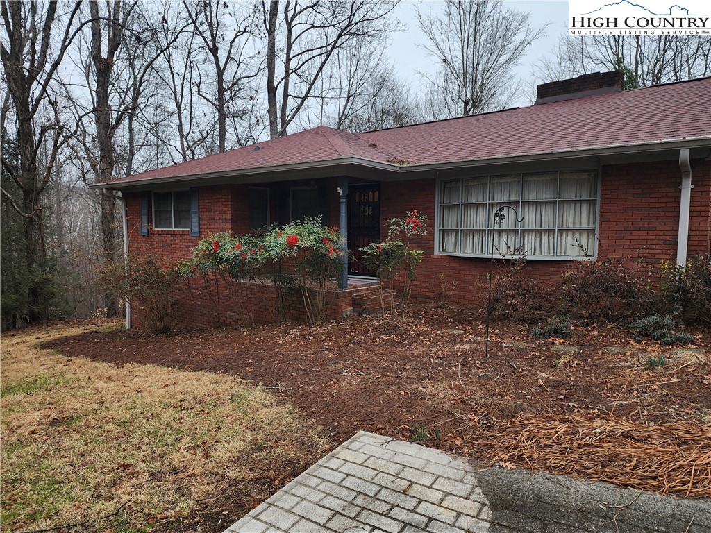 865 Armory Road North Wilkesboro, NC 28659 - Photo 5 of 40 a front view of a house with garden
