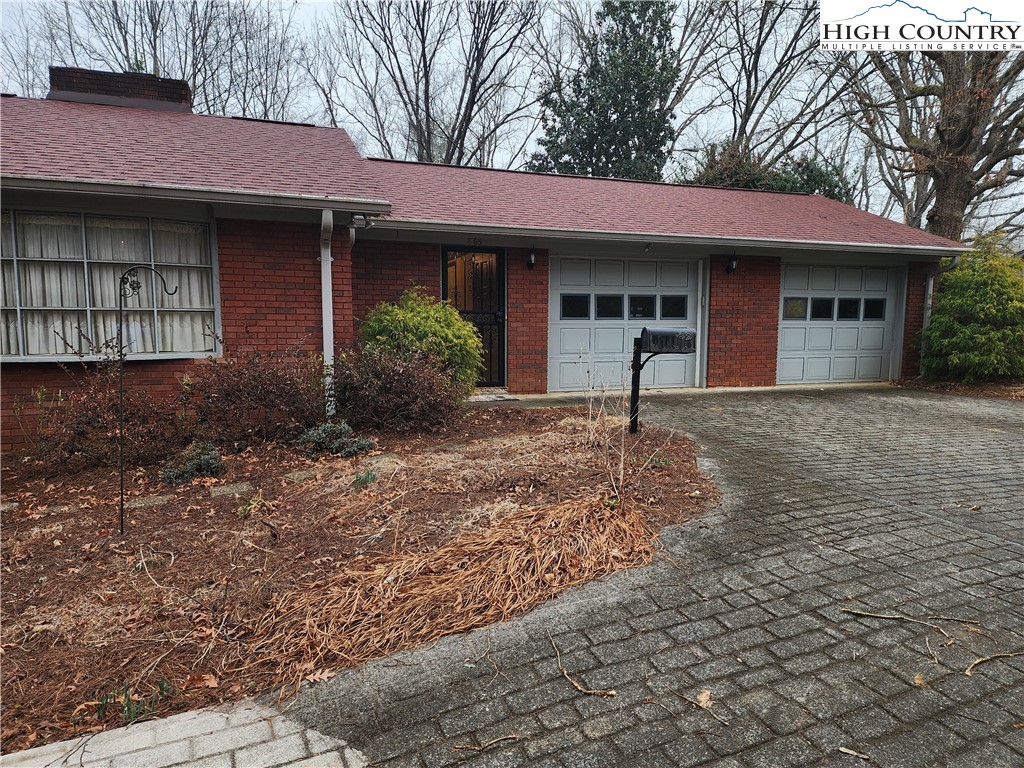 865 Armory Road North Wilkesboro, NC 28659 - Photo 6 of 40 a front view of a house with garden
