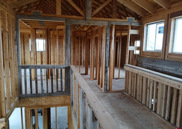 a view of a porch with wooden floor and stairs
