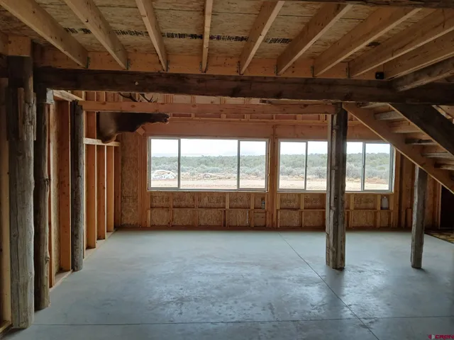a view of an empty room with a balcony
