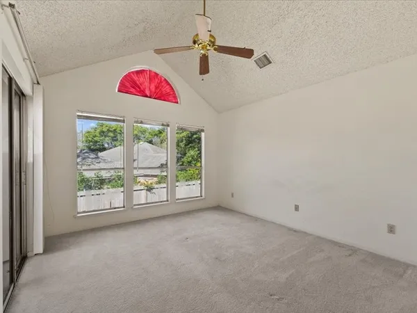 an empty room with fan
