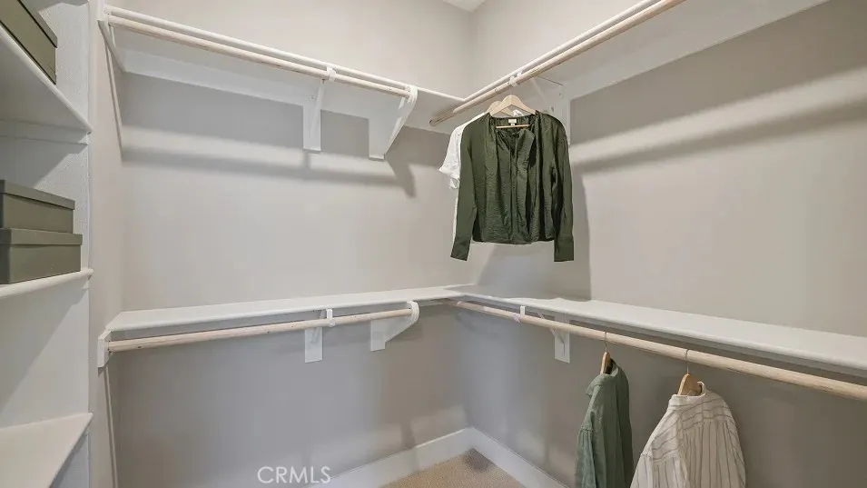 1022 Currant Road Fullerton, CA 92835 - Photo 10 of 25 a view of walk in closet with clothes and shoes