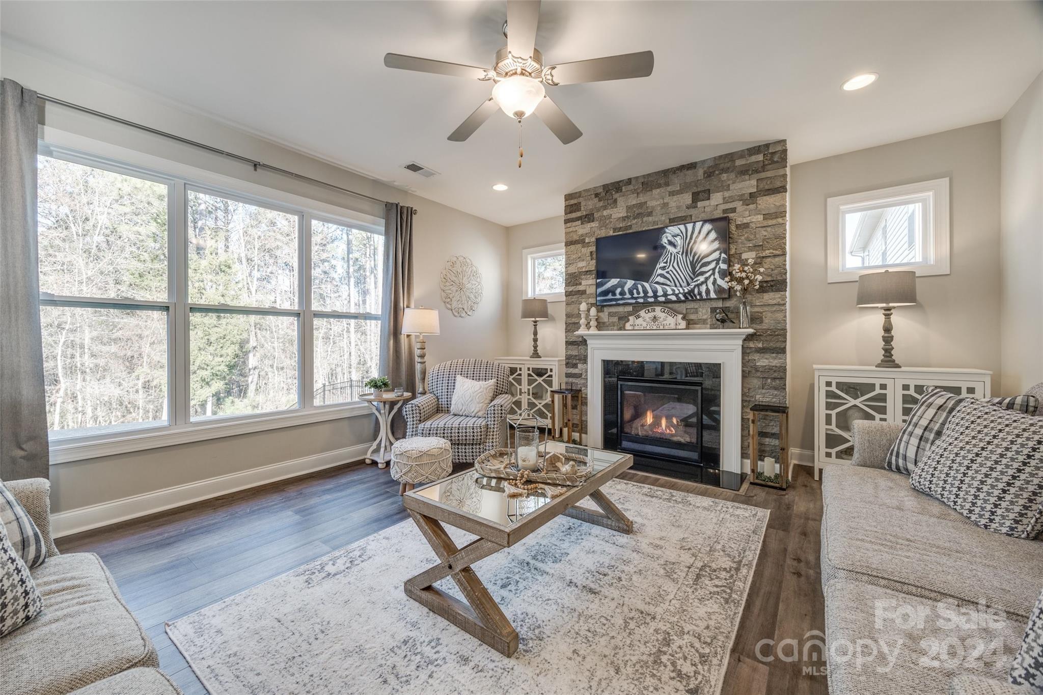 133 Pine Eagle Drive Rock Hill, SC 29732 - Photo 4 of 25 a living room with furniture a rug and a fireplace