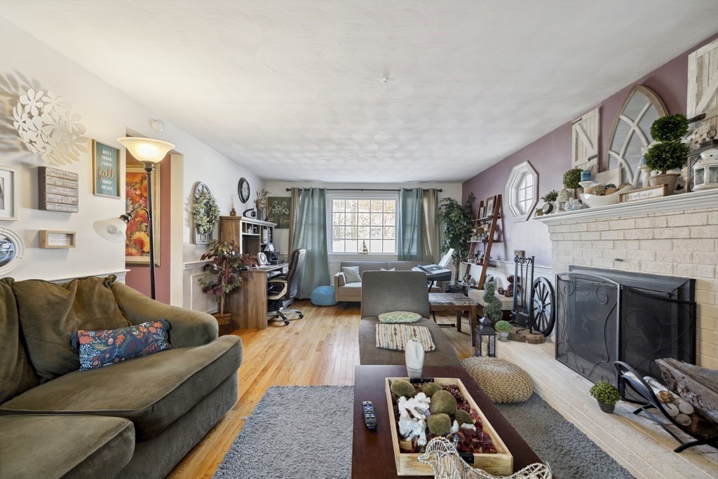 8 Robert Plunkett Circle Randolph, MA 02368 - Photo 16 of 22 a living room with furniture fireplace and flat screen tv