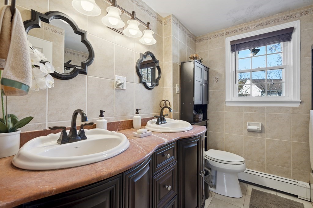 8 Robert Plunkett Circle Randolph, MA 02368 - Photo 19 of 22 a bathroom with a double vanity sink and a mirror