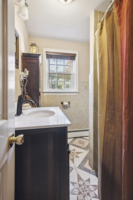 8 Robert Plunkett Circle Randolph, MA 02368 - Photo 20 of 22 a bathroom with a sink and a mirror