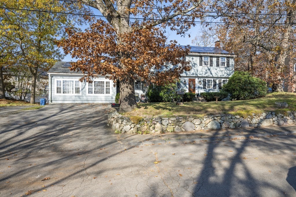 8 Robert Plunkett Circle Randolph, MA 02368 - Photo 2 of 22 a front view of a house with a yard
