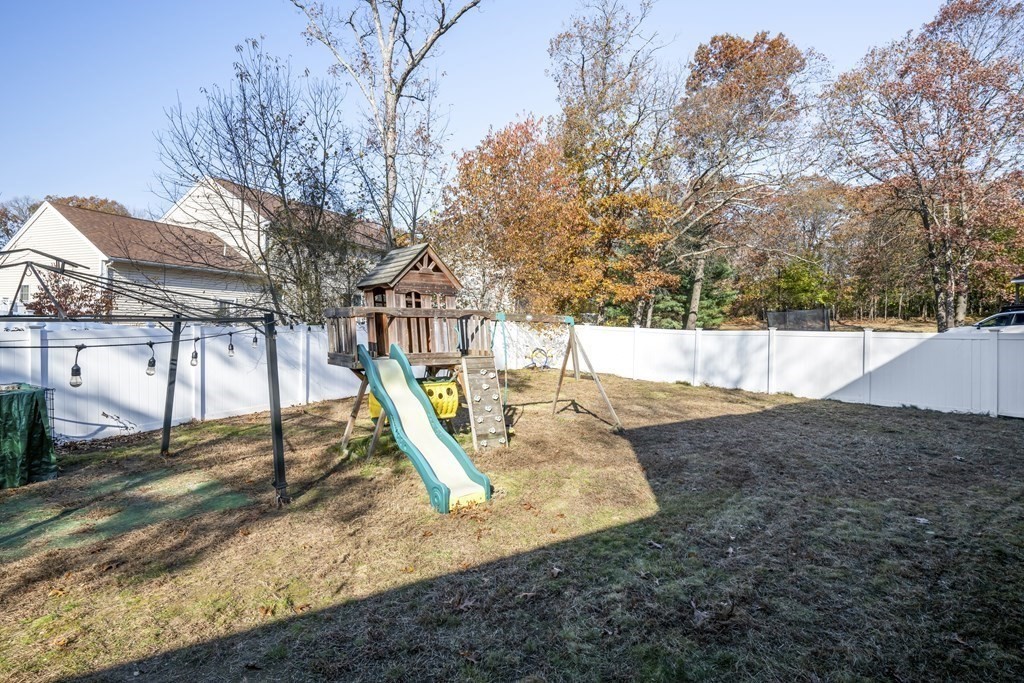 8 Robert Plunkett Circle Randolph, MA 02368 - Photo 21 of 22 a view of a backyard with a tree