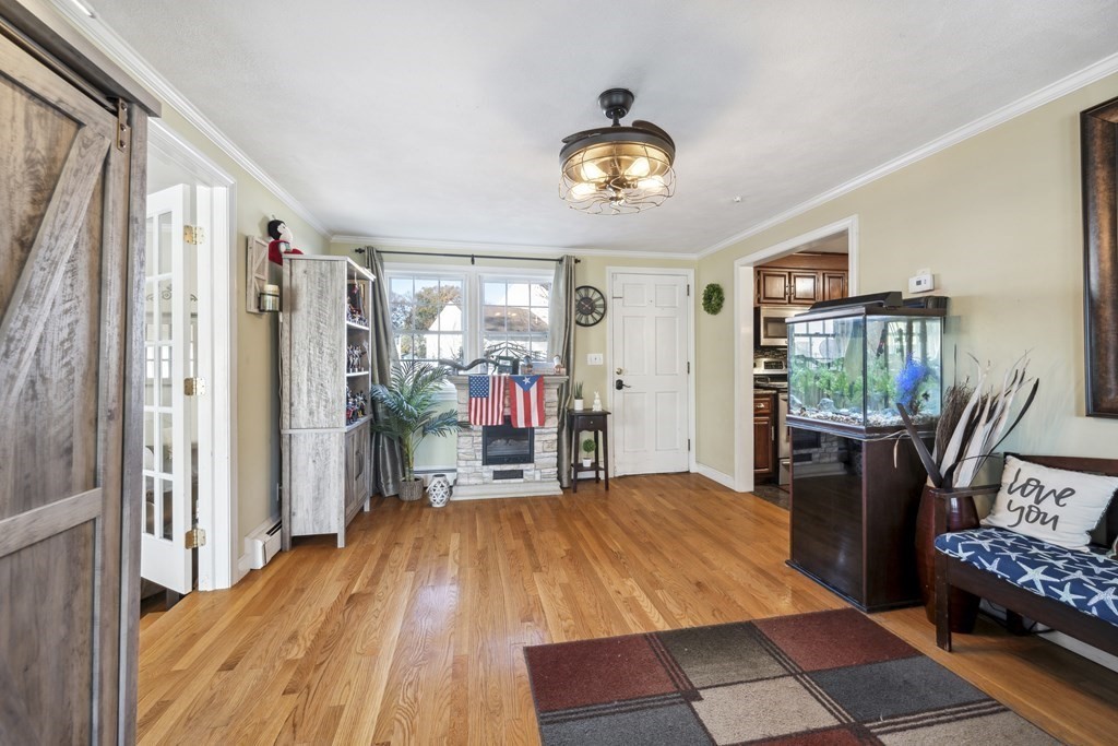 8 Robert Plunkett Circle Randolph, MA 02368 - Photo 3 of 22 a bed room with a bed and a chair