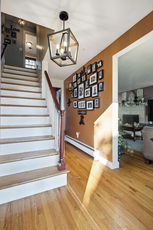 8 Robert Plunkett Circle Randolph, MA 02368 - Photo 4 of 22 a view of entryway and hall with wooden floor