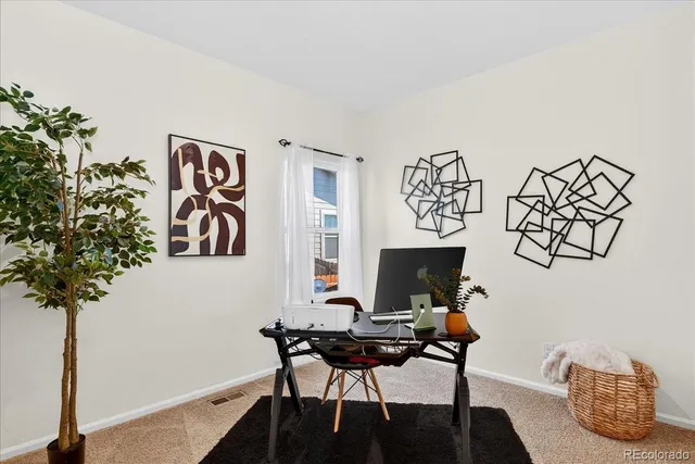 a view of a workspace with furniture