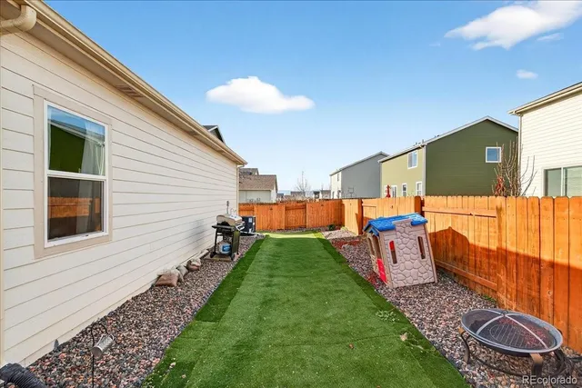a backyard of a house with seating space