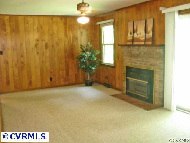 24306 Wedgewood Road Petersburg, VA 23803 - Photo 6 of 10 Other - Family room with brick gas fireplace and sliding glass doors. Opens to the kitchen.