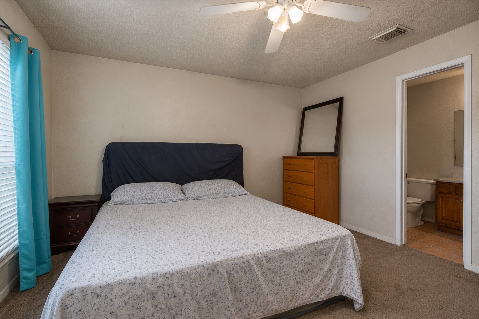 10028 Spring Pl Drive Houston, TX 77070 - Photo 8 of 14 *Primary Room* For tenant privacy, personal belongings have been digitally removed from these photos. The images otherwise reflect the home's current condition, including existing finishes and cosmetic wear.