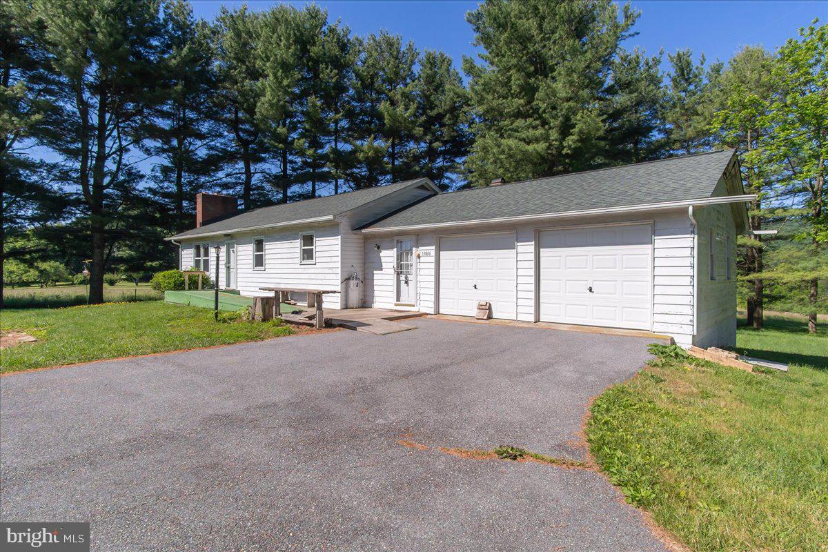 13806 Wolfsville Road Smithsburg, MD 21783 - Photo 2 of 35 a house view with a garden space