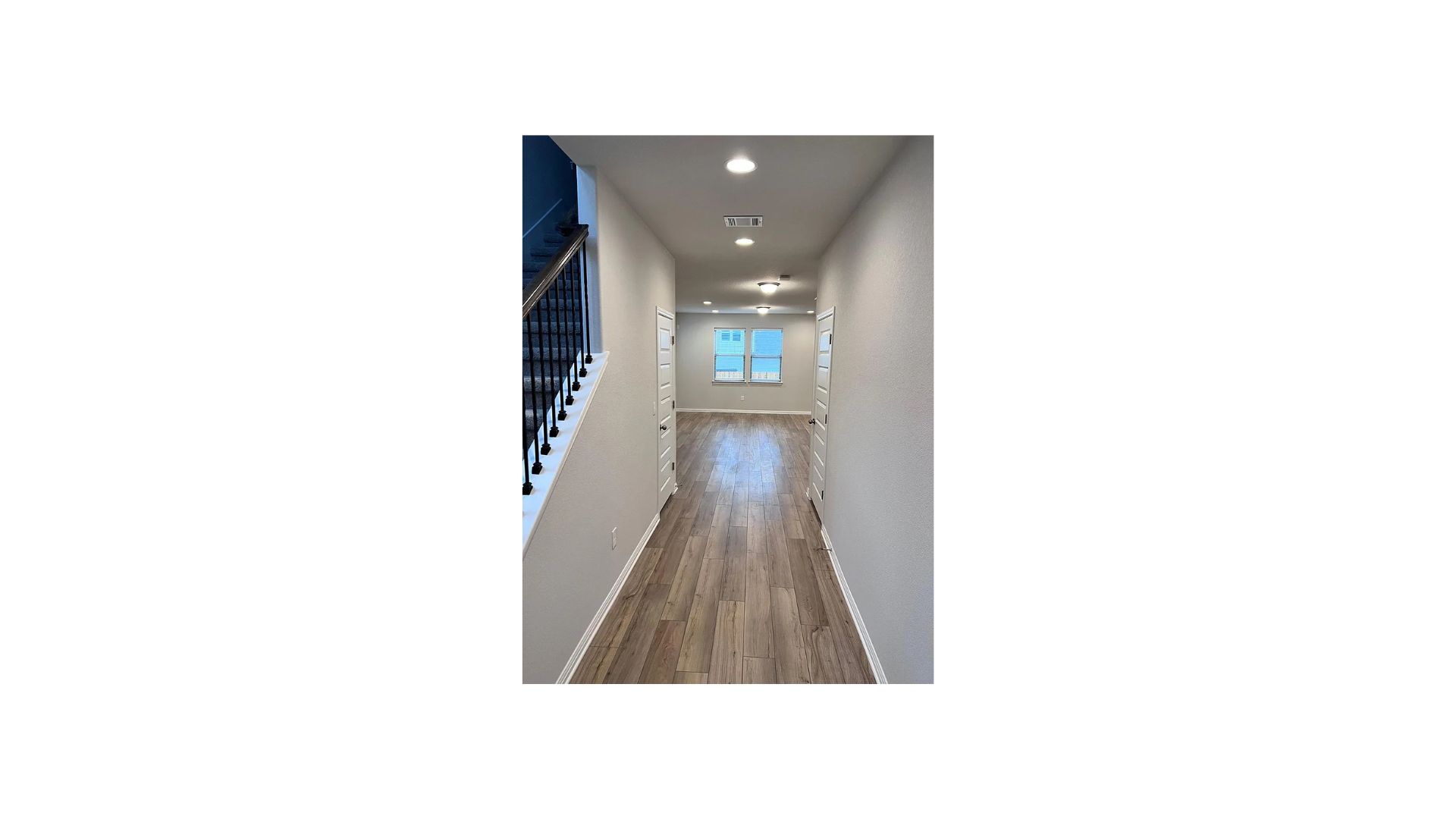 320 Rend Drive Leander, TX 78641 - Photo 4 of 11 a view of a hallway with wooden floor