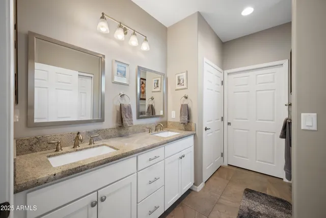 a bedroom with a bed and a lamp on table