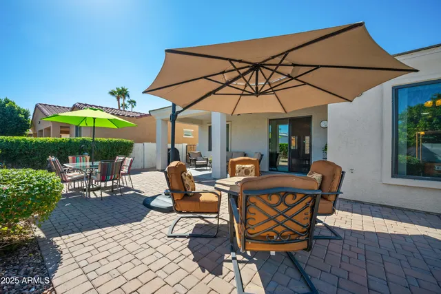 a view of a patio with furniture and table