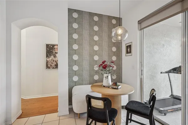 a view of a dining room with furniture and chandelier