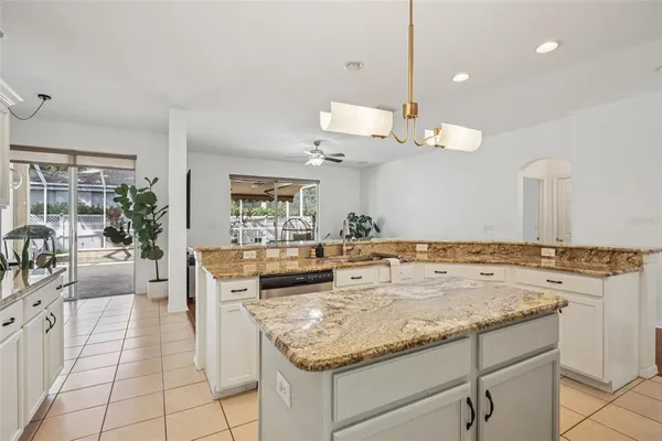 a view of living room with granite countertop furniture and fireplace