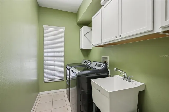 a utility room with washer and dryer